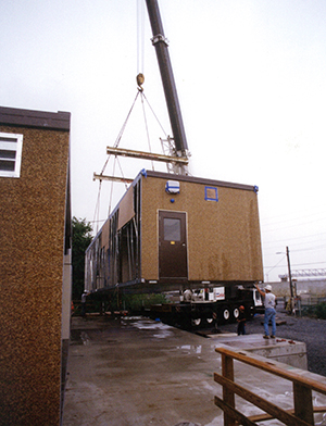 Crane Lifting a Modular Pharmacy building